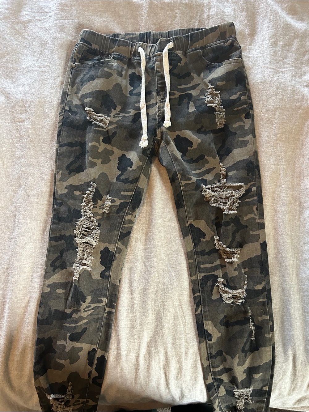 American Bazi Camo Distressed Drawstring Ankle Pants in Olive & Black